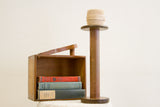 Top of vintage Akron industrial spool, showing wood patina and thread.