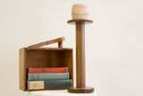 Vintage industrial wooden spool top with beige twine and natural patina.
