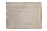 Oushak rug featuring a faded medallion and soft ivory, pink, sage abrashes, 1'7