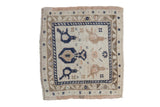 Distressed Oushak square rug with central tree of life, bird motifs, in ivory, navy, beige.