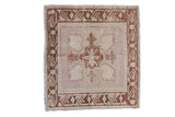 Distressed vintage Oushak square rug with quatrefoil medallion in soft copper, beige, and mauve.