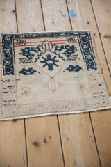 Vintage Oushak square mat showing its characterful, time-softened wear and texture.