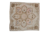 Distressed Oushak square rug featuring a faded starburst medallion, Rococo border, in beige and rose.