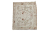Distressed vintage Oushak square rug mat, faded ivory and beige with tree of life design.