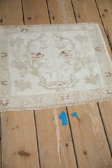Vintage distressed Oushak rug, ivory and dusty copper tree-of-life motif.