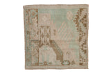Vintage distressed Oushak square rug with a geometric sampler design in sea foam, olive, and ivory.