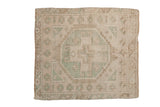 Vintage Distressed Oushak square rug with geometric octagonal medallion in beige and sea foam green.