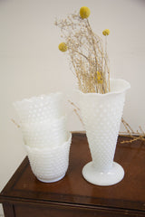 Distinct hobnail pattern on the bases of vintage white milk glass vases.