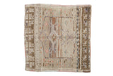 Vintage distressed Oushak square rug with a faded diamond medallion in ivory, brown, and soft pink tones.