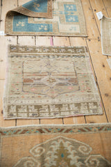 A curated collection of vintage Turkish rugs, with the distressed Oushak mat in the foreground.
