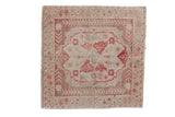 Distressed vintage Oushak square rug with ivory quatrefoil medallion and dusty red floral motifs.