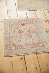 Machine bound side and distressed texture of vintage Oushak rug.