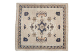 Vintage Distressed Oushak Square Rug Mat with oversized medallion, wave border, in ivory, dusty navy, and pale copper.