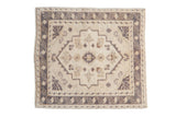 Vintage Distressed Oushak square mat, geometric finned blossoms, and soft neutral hues.