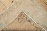 Hand-knotted reverse weave and worn pile texture of the vintage Oushak rug.