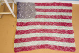 Hand-knotted Folk Art American Flag rag rug, 13 white stars, faded red and blue stripes.