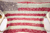 Folk Art American Flag rag rug with interwoven red and faded white linen texture.