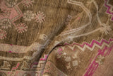 Distressed Oushak rug pile with vibrant magenta zigzag motif and mottled coffee brown.
