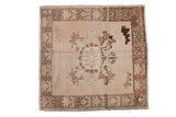 Vintage distressed Oushak square rug with dusty rose floral field and brown stylized border, 2'4