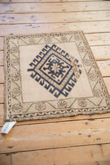 Distressed vintage Oushak border, meandering vine pattern, and cobalt blue diamond motif.