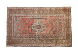 Distressed Anatolian rug, stepped medallion, faded blush field, floral borders, 3'4