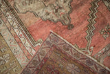 Blush and bronze distressed pile on a Vintage Anatolian rug, showing its intricate reverse.