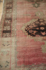 Pale rose distressed Oushak runner pile with aubergine serrated motifs and visible foundation.