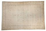 Vintage Distressed Sparta Carpet with ivory center medallion, muted blue, and brown accents.