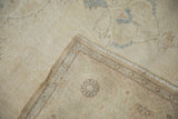 Vintage distressed Sparta carpet fold, worn ivory pile, visible foundation, patterned reverse.