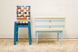 New Yorker Decorative Chair made from blue wood and woven vintage magazine pages.