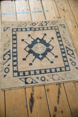 Distressed Oushak square rug, geometric starburst medallion, dusty navy, cream, oxidized silver. 2x2.