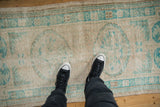 Mostly even wear to knot heads shown on a distressed vintage Oushak rug.