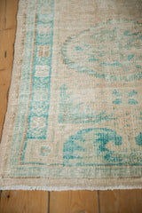 Intact side cord selvage and distressed texture on a vintage Turkish Oushak runner.