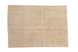 Heavily distressed vintage Melas rug with a faded prayer motif in soft beige and pale dusty blush.