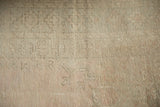 Soft, distressed texture of a vintage Turkish rug with wear to the knot heads.