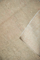 Detail of the woven foundation and distressed low pile of a hand-knotted Turkish Melas rug.