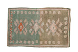 Distressed Oushak rug, triple diamond medallions, finned floral designs on abrashed mint and dusty green.