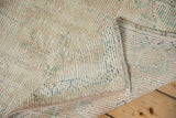 The reverse side of a vintage Oushak rug showing its authentic hand-knotted construction.