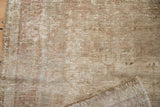 Worn pile, exposed foundation, and reverse of a distressed Oushak rug with faint mauve hues.