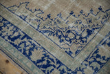 Stepped corner spandrel in cobalt blue showing the textural wear of the vintage Oushak pile.