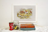 Vintage 1972 Equestrian Lithograph of orange-jacketed riders, horses, and running hounds in a lively scene, 12x16 inches.