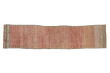 Distressed vintage Oushak runner with abrashed pale red, dusty rose field and muted geometric borders.