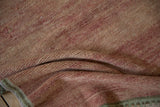 Distressed Oushak runner's folded texture, featuring abrashed pale ruby red and olive green edge.
