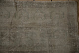 Distressed texture of a vintage Oushak rug showing even wear across the knot heads.