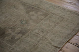 Even wear across the knot heads reveals the hand-knotted foundation of this distressed Oushak rug.