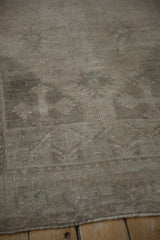 Low pile of a distressed Oushak rug showing even wear across the knot heads and foundation.