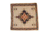 Distressed vintage Oushak square rug, ivory field with navy medallion, red guls, and banded border.