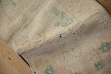 Vintage Distressed Oushak rug's textured pile revealing knot heads and soft green patterns.