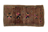 Distressed Oushak rug, vivid fuchsia, cobalt, emerald pinwheel stars on abrashed brown.