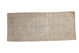 Vintage distressed Oushak rug runner in neutral sand with a central powder blue floral stem motif.